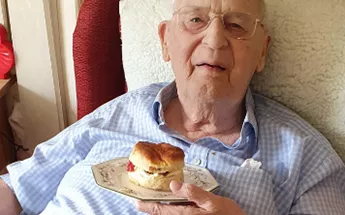 George from Ivy House indulging in his cream tea Image