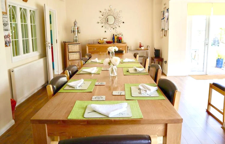 Beautiful and bright dining room where residents come together to share mealtimes