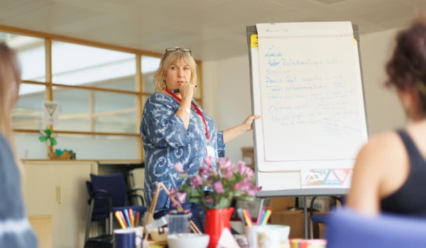 Woman Leading Meeting In Office