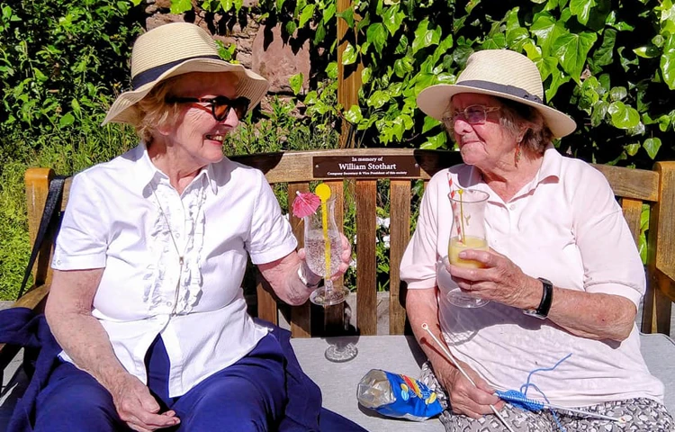 Residents enjoying the sunshine at Lear House, West Kirby CH48 5DT