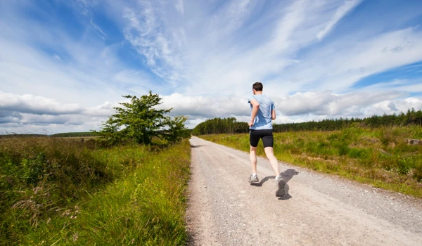 Man Running Through Countryside