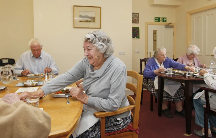Residents sat in the dining room enjoying a meal