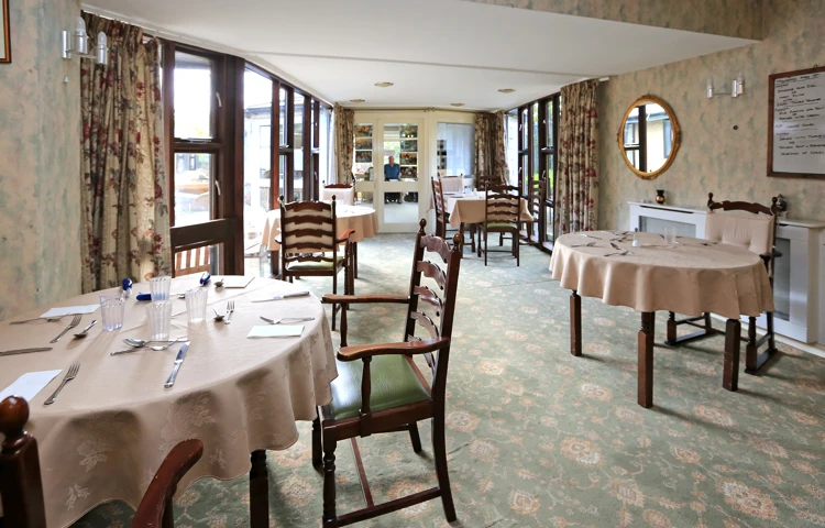Dining tables set for dinner